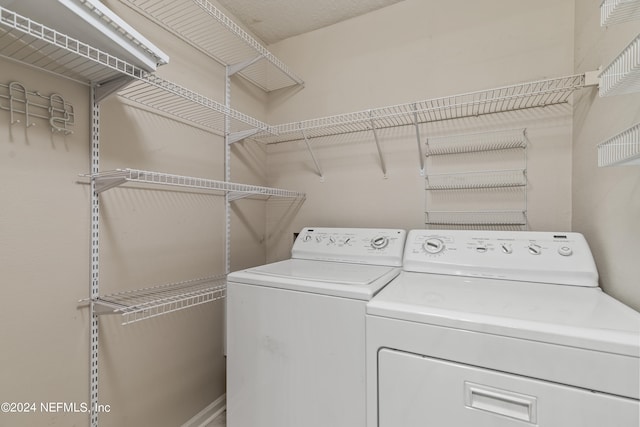 washroom featuring independent washer and dryer