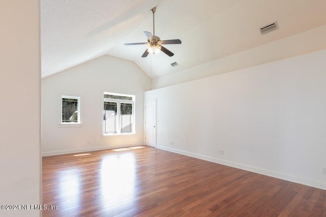 empty room featuring wood-type flooring, vaulted ceiling, and ceiling fan