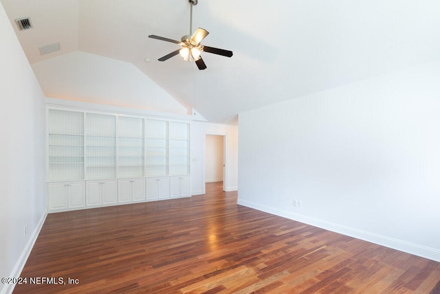 interior space featuring ceiling fan, lofted ceiling, and dark wood-type flooring