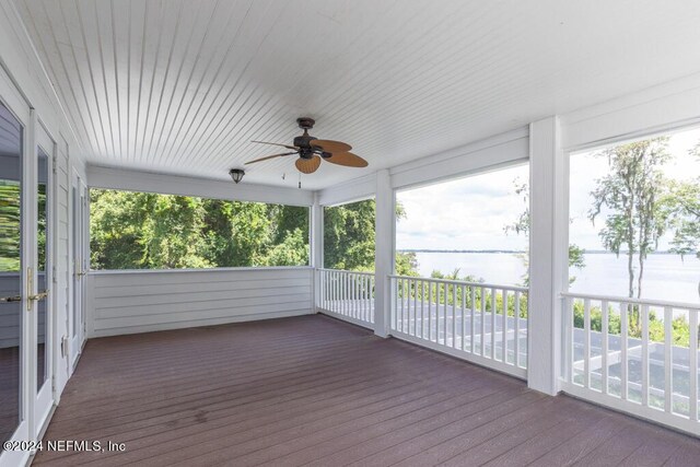 wooden deck featuring ceiling fan