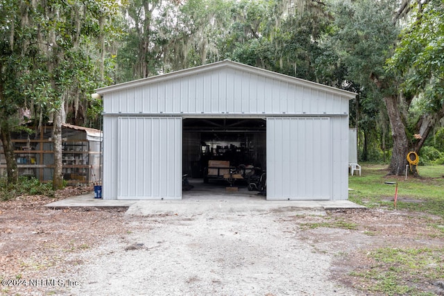 garage featuring wooden walls