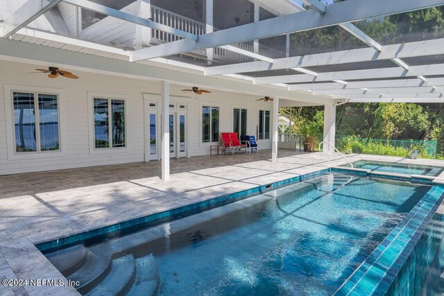 view of pool with ceiling fan and a patio area