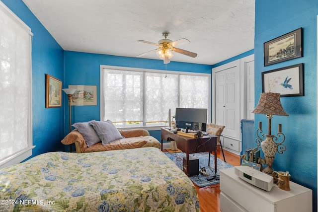 bedroom featuring ceiling fan and hardwood / wood-style flooring