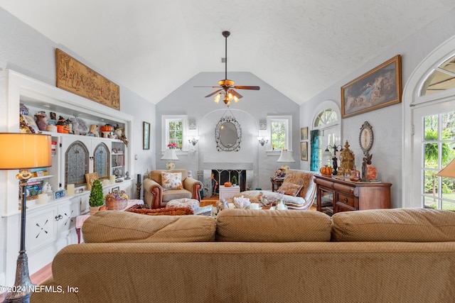 living room with lofted ceiling and ceiling fan