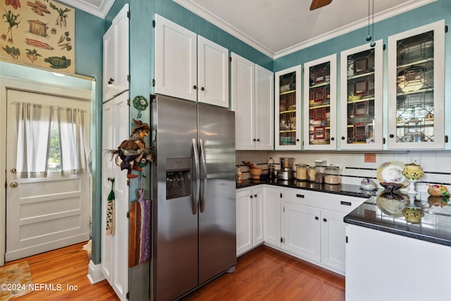 kitchen featuring tasteful backsplash, stainless steel fridge with ice dispenser, white cabinetry, dark hardwood / wood-style floors, and crown molding