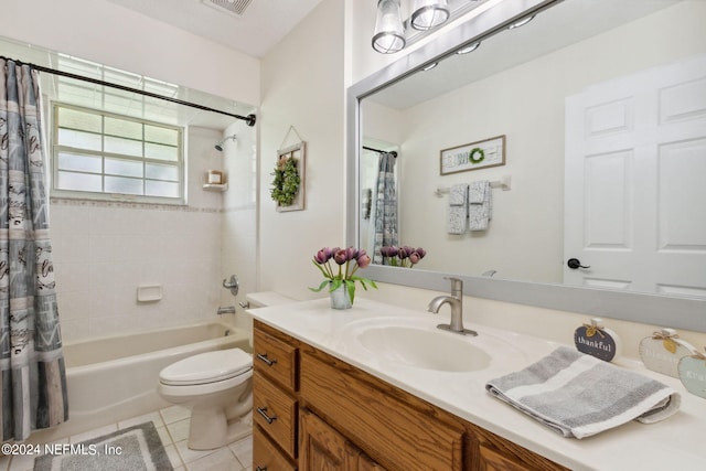 full bathroom featuring vanity, shower / tub combo, toilet, and tile patterned flooring