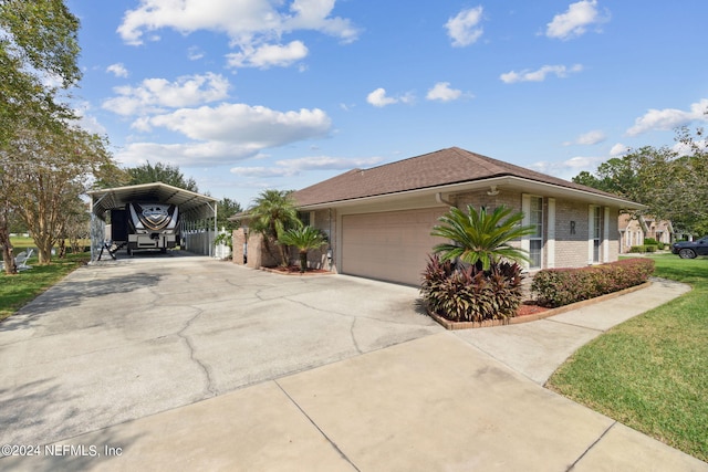 view of property exterior with a yard, a carport, and a garage