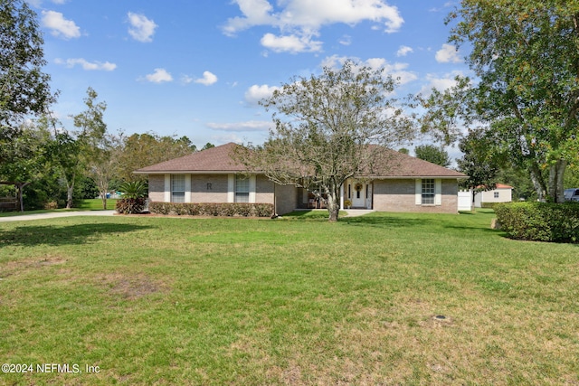 single story home with a front lawn