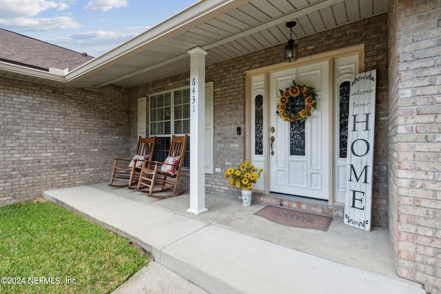 property entrance featuring covered porch