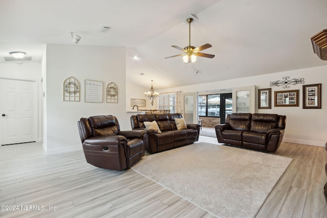 living room featuring light hardwood / wood-style flooring, lofted ceiling, ceiling fan with notable chandelier, and french doors