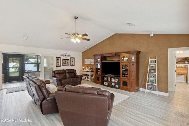 living room with ceiling fan, lofted ceiling, and light hardwood / wood-style floors