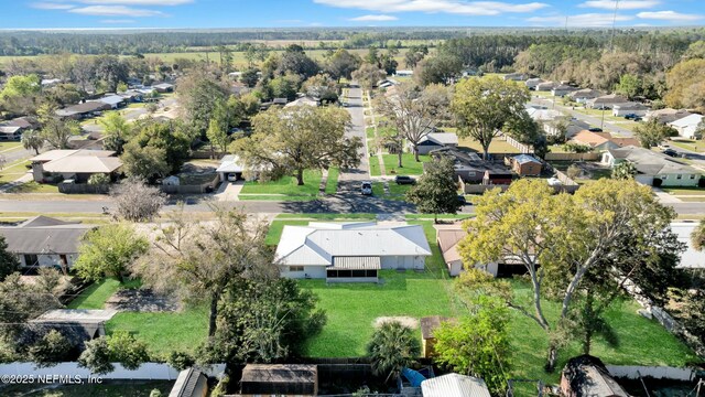 birds eye view of property with a residential view