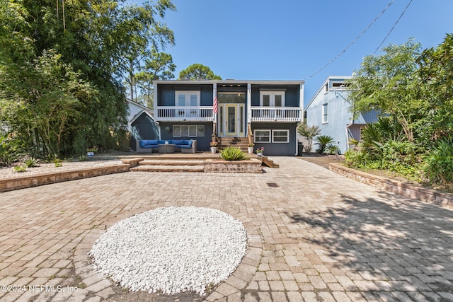 view of front of house with a patio area