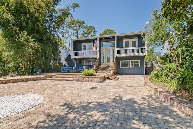 view of front of home with a balcony