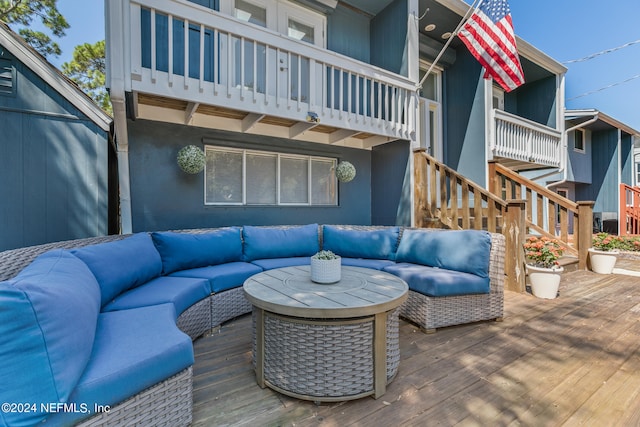 wooden deck featuring an outdoor living space