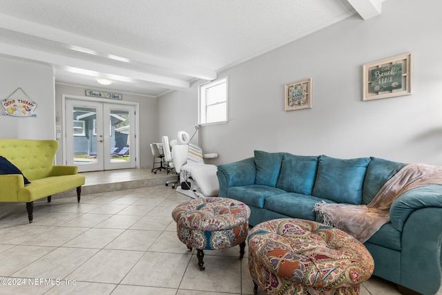 tiled living room with a textured ceiling, beamed ceiling, and french doors