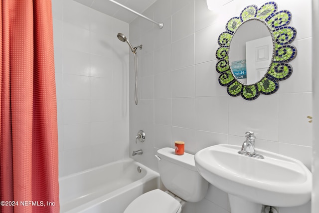 full bathroom featuring backsplash, tile walls, shower / bath combo with shower curtain, and toilet