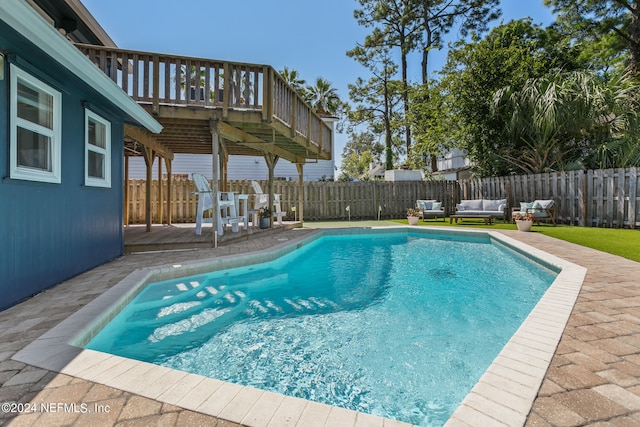 view of pool featuring a wooden deck