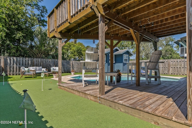 exterior space with outdoor lounge area and a fenced in pool