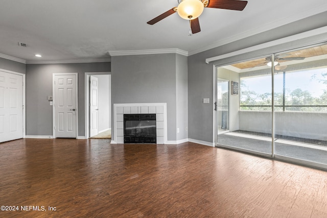 unfurnished living room featuring ceiling fan, ornamental molding, hardwood / wood-style flooring, and a tile fireplace