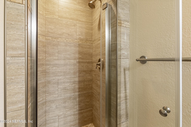 bathroom with an enclosed shower