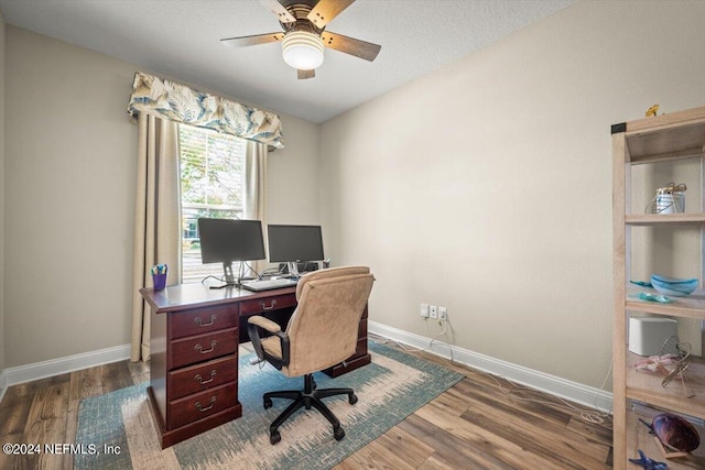 office area with hardwood / wood-style floors and ceiling fan