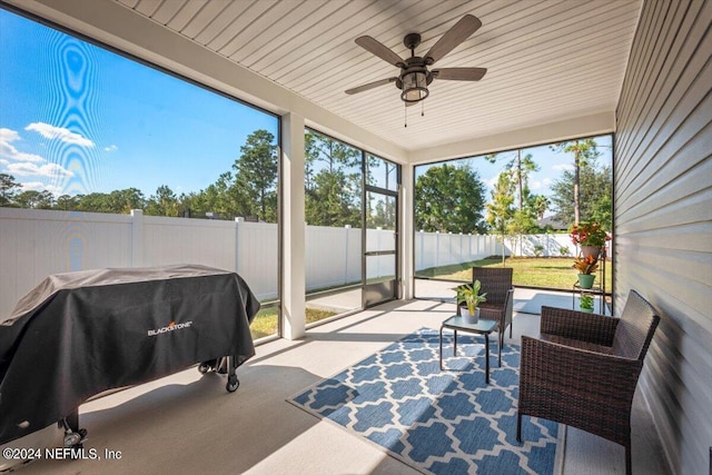 sunroom / solarium with ceiling fan