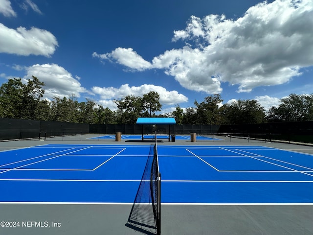 view of sport court featuring basketball hoop