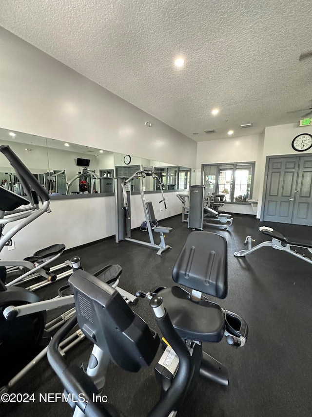 workout area featuring a textured ceiling