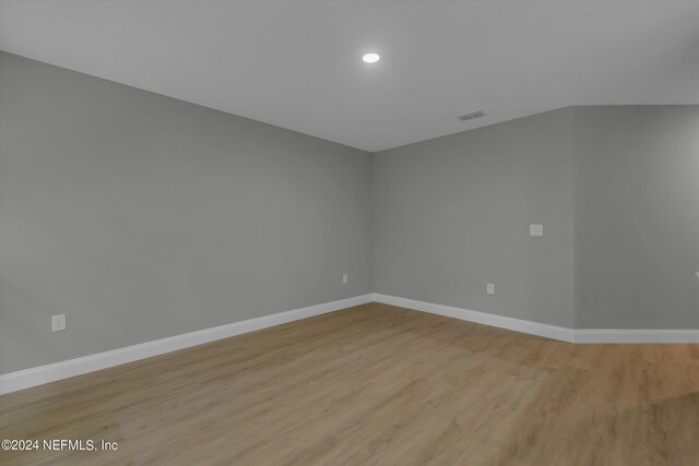 spare room with light hardwood / wood-style floors