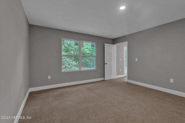 unfurnished room with carpet floors