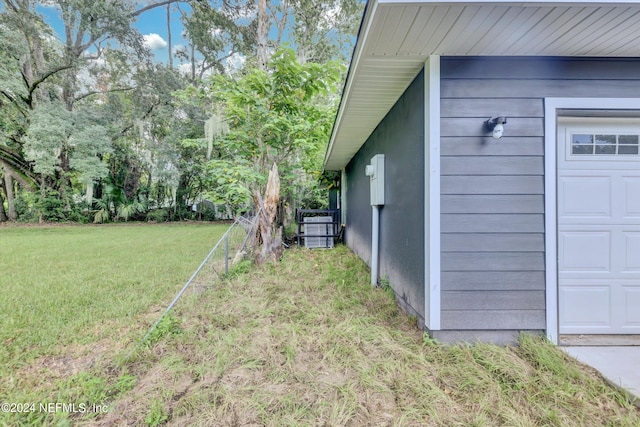 view of yard with a garage