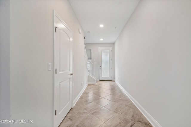 hallway with light tile patterned flooring