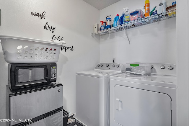 laundry room featuring washing machine and clothes dryer