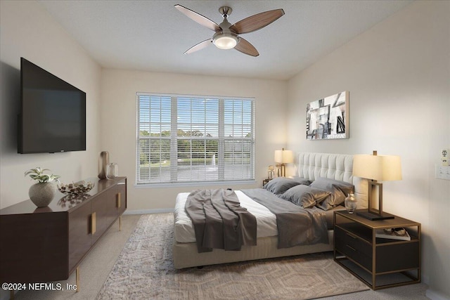 carpeted bedroom with ceiling fan