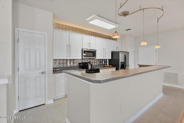 kitchen with white cabinetry, a kitchen island with sink, and appliances with stainless steel finishes