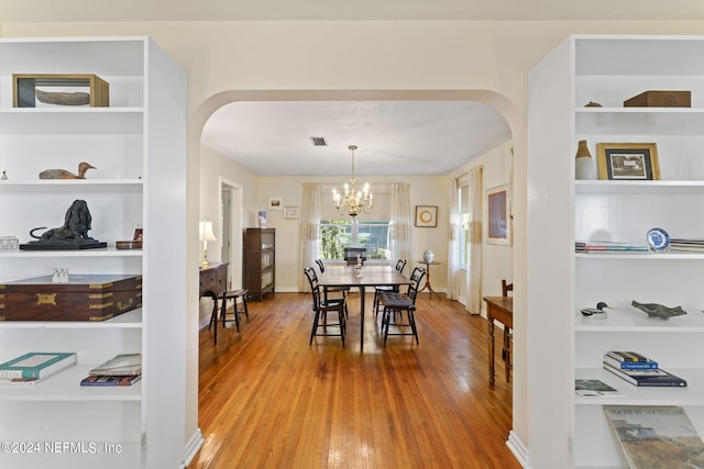 dining area with a chandelier and hardwood / wood-style floors