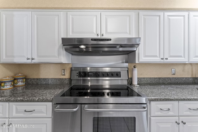 kitchen with white cabinets and stainless steel electric stove