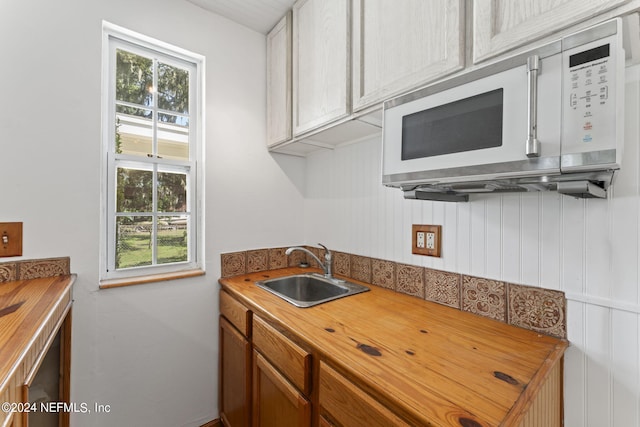 kitchen with butcher block counters and sink