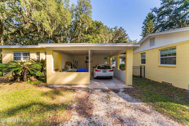 view of parking / parking lot with a carport