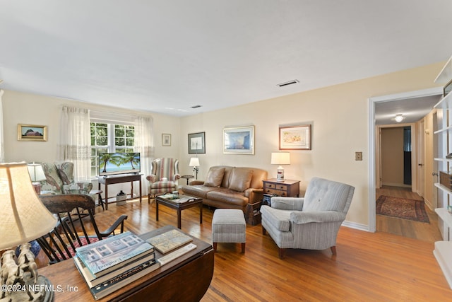 living room with light hardwood / wood-style flooring