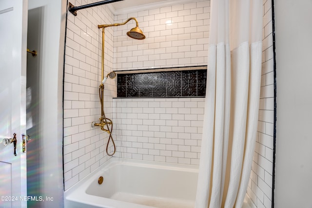 bathroom featuring ornamental molding and shower / bathtub combination with curtain