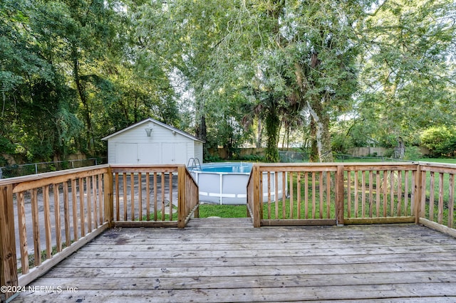 wooden terrace with a shed