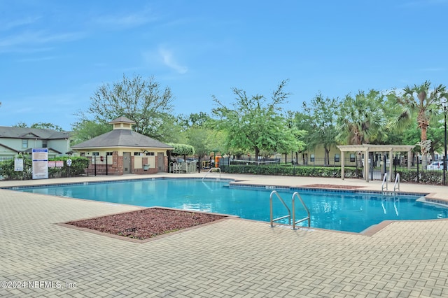 view of pool featuring a pergola and a patio