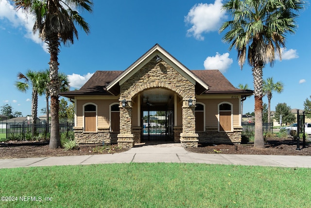 view of front of home featuring a front yard and a porch