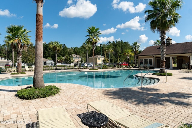 view of swimming pool featuring a patio