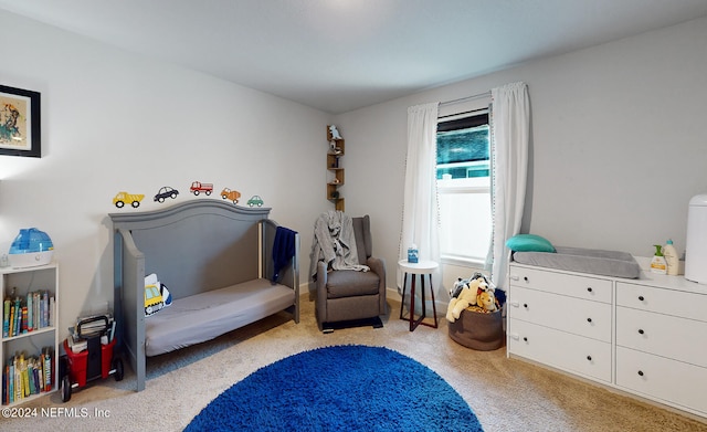 bedroom featuring light carpet