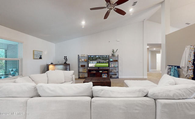 living room with light carpet, ceiling fan, and high vaulted ceiling