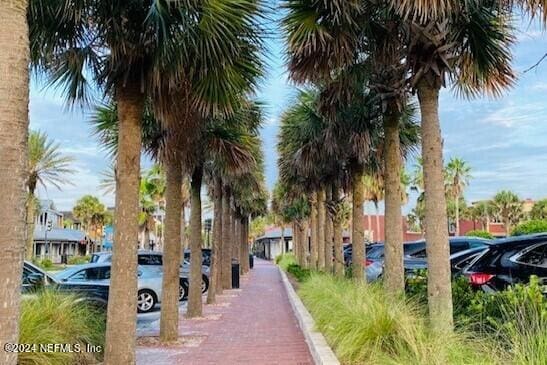 view of property's community with uncovered parking