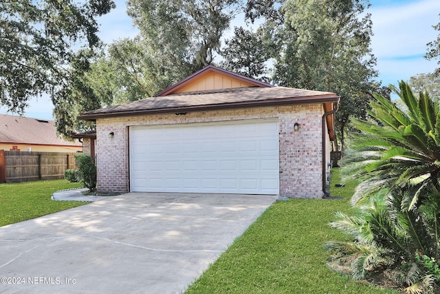 garage featuring a yard